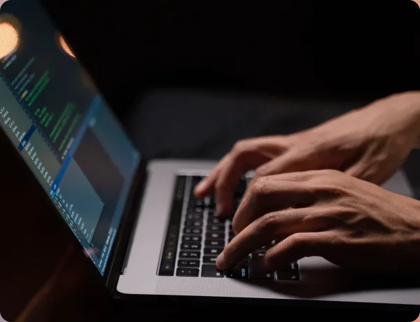 A developer working on a laptop